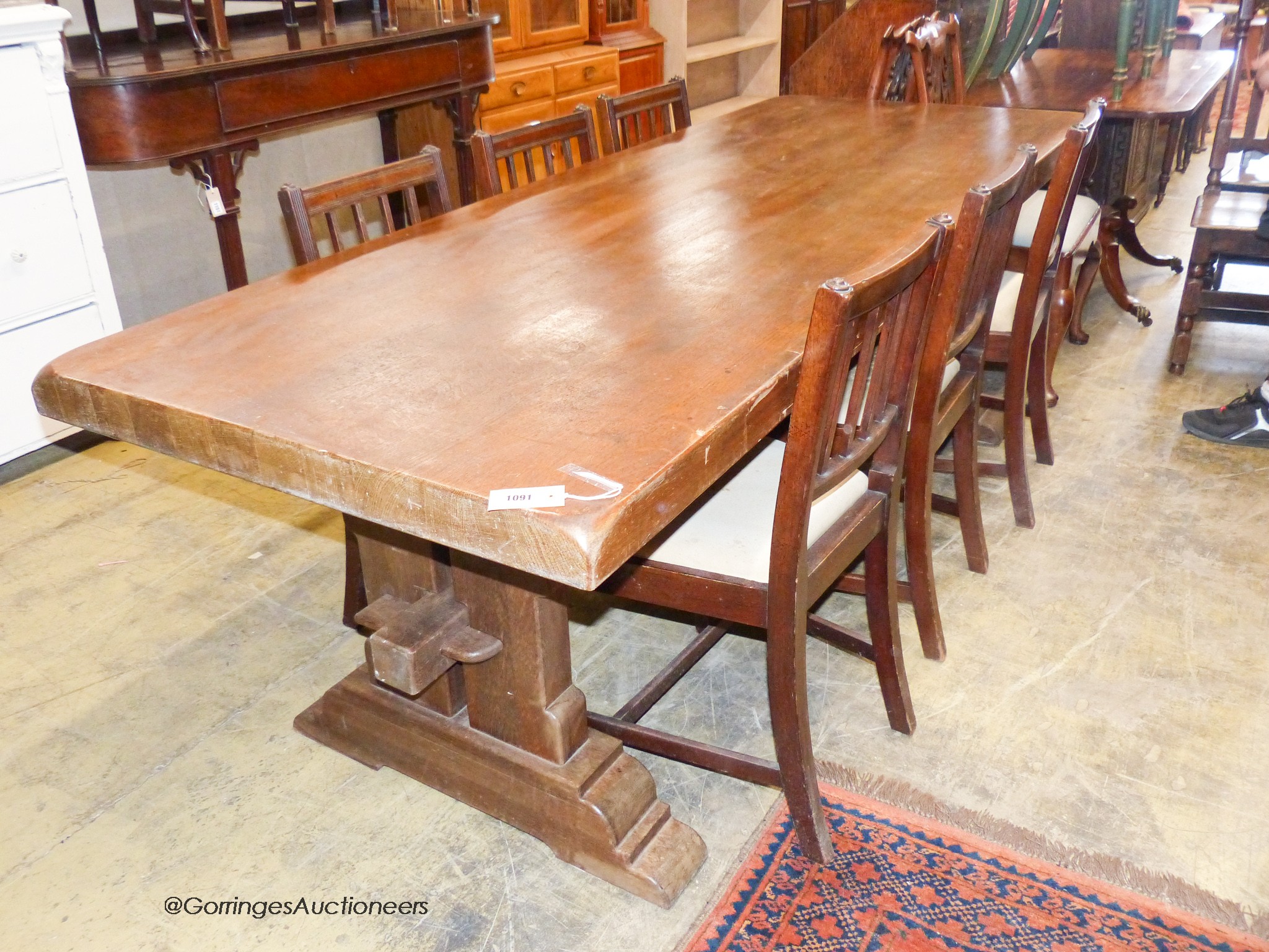 An 18th century style rectangular oak refectory dining table, width 230cm, depth 85cm, height 77cm